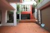 L-shaped modern house with swimming pool in Au Co street