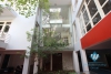 L-shaped modern house with swimming pool in Au Co street