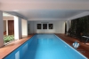 L-shaped modern house with swimming pool in Au Co street
