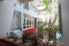 L-shaped modern house with swimming pool in Au Co street