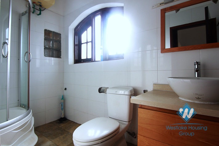 Unfurnished 4 bedrooms house with yard and garage for rent in Au Co st, Tay Ho area.
