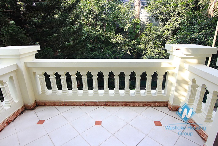 Unfurnished 4 bedrooms house with yard and garage for rent in Au Co st, Tay Ho area.