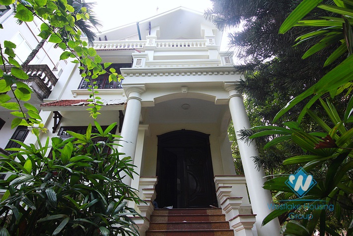 Unfurnished 4 bedrooms house with yard and garage for rent in Au Co st, Tay Ho area.